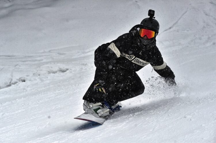    person-in-black-jacket-and-black-pants-riding-on-snowboard-3869851